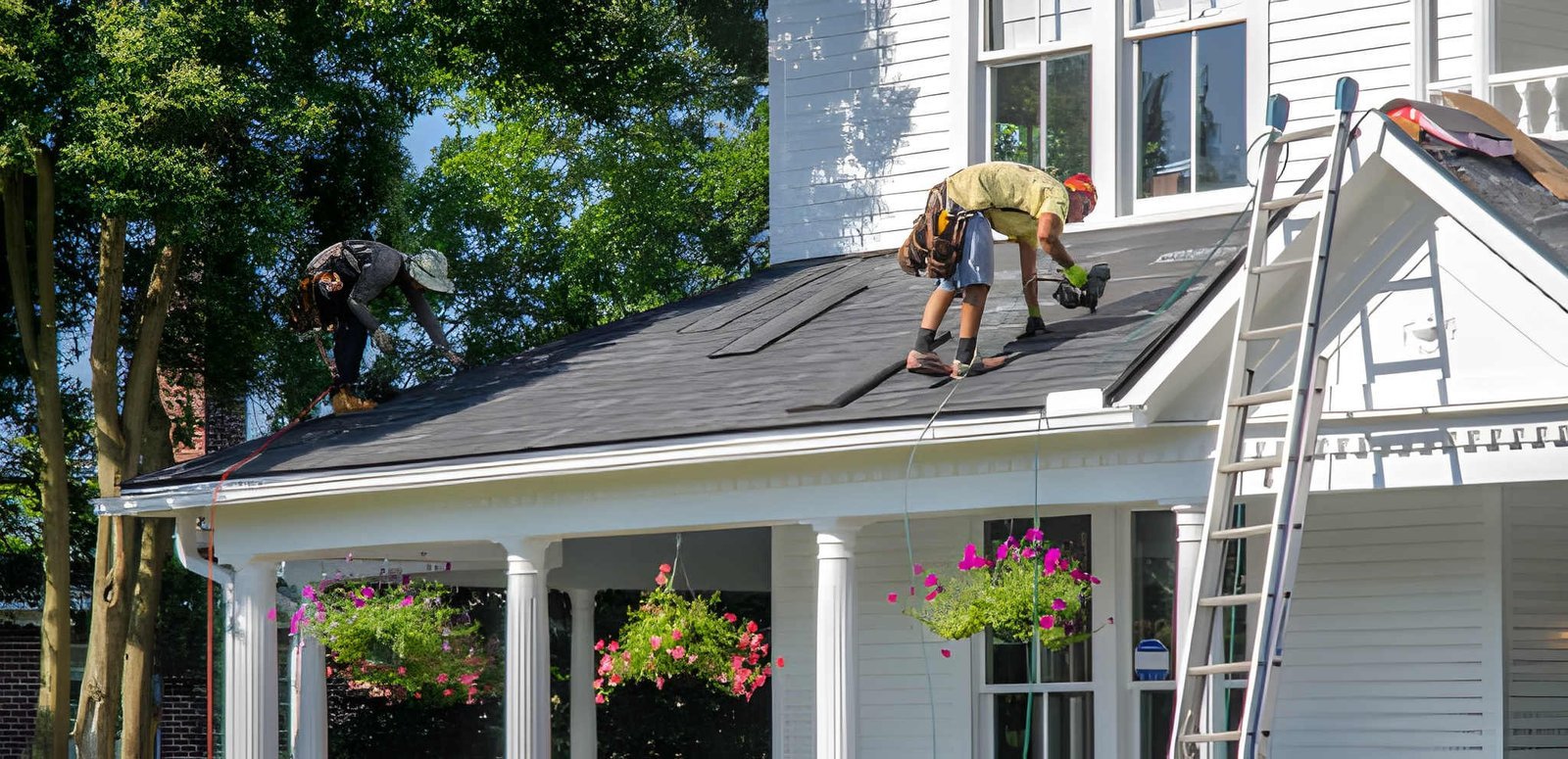 Professional roofer repairing a residential roof