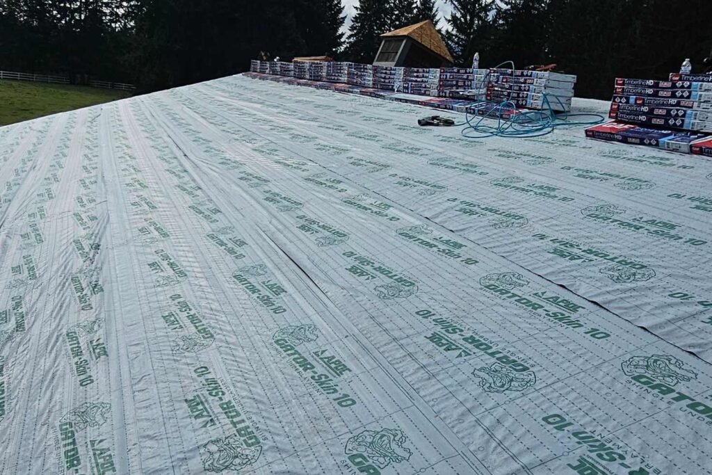 Tools sitting on a plywood roof deck.